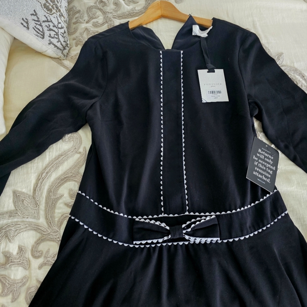 Elegant Black Dress with White Trim